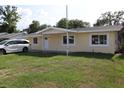 Charming single-story home featuring a well-maintained lawn and bright, neutral paint at 124 Auburn Rd, Auburndale, FL 33823
