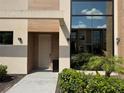 Inviting townhome entrance with modern design and lush landscaping at 3060 Rockefeller Way # 156, Kissimmee, FL 34747