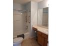 Bright bathroom features a shower-tub combo, ample vanity space, and accessibility features at 3405 Forsythe Ter, The Villages, FL 32162