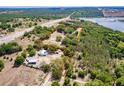 Aerial view of a large lot with a beautiful home featuring a red outline of the property's boundary at 17358 Hwy 27, Clermont, FL 34715