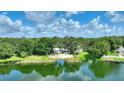Scenic view of the property and the lake, highlighting its waterfront location at 3610 Pershing Ave, Orlando, FL 32812