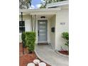 Close up of front door with modern design and updated fixtures at 3610 Pershing Ave, Orlando, FL 32812