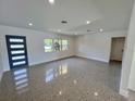 Bright living room with large windows and plenty of open space at 3610 Pershing Ave, Orlando, FL 32812