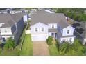 Beautiful two-story home with a well-manicured lawn and attached two car garage, located in a Gathering-friendly neighborhood at 1142 Blarney St, Minneola, FL 34715