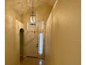 Bright foyer with ceramic tile floors and a decorative light fixture in a neutrally painted home at 1003 Clearpointe Way, Lakeland, FL 33813