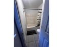 Cozy bathroom featuring a shower with tub, tile flooring, toilet and black shower rod at 6762 Pomeroy Cir, Orlando, FL 32810