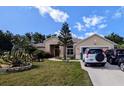 Lovely single-Gathering home with well-maintained landscaping, on a sunny day at 5352 Treasure View Way, Leesburg, FL 34748