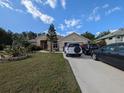 Beautiful one-story home with a cozy front yard and private driveway at 5352 Treasure View Way, Leesburg, FL 34748