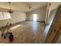 Large living room featuring tile floors and sliding glass door at 13026 Baltimore Woods Ln, Orlando, FL 32824