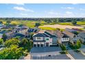 Gorgeous aerial view of a luxury home near a golf course in a beautiful neighborhood at 1514 Corolla Ct, Reunion, FL 34747