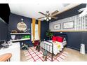 Unique bedroom with bold decor, fan, and playful design accents, creating an imaginative space at 13257 Sw 29Th Cir, Ocala, FL 34473