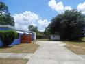 Spacious backyard with concrete patio at 902 S Scenic Hwy, Lake Wales, FL 33853
