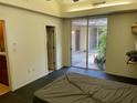 Bedroom with sliding glass door to outdoor patio and ensuite bathroom at 246 Ridge Manor Dr, Lake Wales, FL 33853