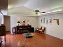 Bright living room with tile floors and a vaulted ceiling featuring a fan at 246 Ridge Manor Dr, Lake Wales, FL 33853