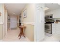 Inviting home entryway featuring tile floors, neutral walls, and access to a modern kitchen at 4 Oceans West Blvd # 502B, Daytona Beach, FL 32118