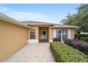 Inviting single-story home with a beautiful brick walkway and manicured landscaping at 8166 Sw 80Th Ter, Ocala, FL 34476