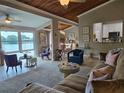 Comfortable living room with stylish seating and scenic views of the water at 200 Maitland Ave # 114, Altamonte Springs, FL 32701
