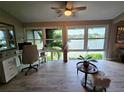 Bright home office with large windows offering stunning water views and light wood flooring at 200 Maitland Ave # 114, Altamonte Springs, FL 32701