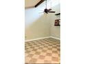 Bright room with patterned floor, ceiling fan, and large windows at 5127 Eaglesmere Dr # A02, Orlando, FL 32819