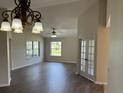 Beautiful living room with hardwood floors and natural light coming through the windows at 17430 Se 110Th Ter, Summerfield, FL 34491