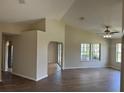 Bright living room with hardwood floors, vaulted ceiling, and plenty of natural light at 17430 Se 110Th Ter, Summerfield, FL 34491