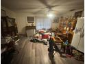 Cozy living area with wood-look vinyl flooring, natural light, and ceiling fan at 725 6Th Ne St, Fort Meade, FL 33841