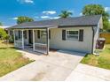 A well-kept home with a tidy front yard and a convenient driveway leading up to the entrance at 219 Vermont Ave, St Cloud, FL 34769