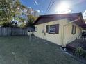 Side yard view of a single-story home, showcasing its exterior and yard space at 15 Monroe Ave, Debary, FL 32713