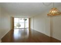 Bright living room with hardwood floors and expansive windows offering scenic views at 690 Osceola Ave # 405, Winter Park, FL 32789