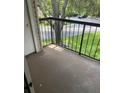 Private balcony overlooking lush greenery, offering a tranquil outdoor space at 1948 Lake Atriums Cir # 132, Orlando, FL 32839