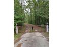 A gated entrance welcomes you to this private and serene property at 10411 County Road 474, Clermont, FL 34714