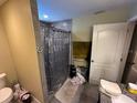 Modern bathroom features tiled shower and vanity with storage at 2094 Penn Dr, Deland, FL 32724