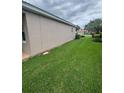 A spacious well-manicured backyard offers ample room for various outdoor activities at 440 Bay Leaf Dr, Kissimmee, FL 34759