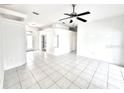 Bright living room boasting tile floors, recessed lighting, and an open layout perfect for entertaining at 11315 Cypress Shore Ct, Clermont, FL 34711
