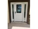 Elegant front door with glass panels and decorative details at 13074 Sw 104Th Ln, Dunnellon, FL 34432