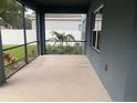 Enclosed lanai offering a relaxing view of the beautifully landscaped backyard at 1710 Summer Rose Dr, Mount Dora, FL 32757