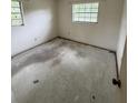 A secondary bedroom with window offering natural light, awaiting personalized updates at 1516 Avenue D Ne, Winter Haven, FL 33881