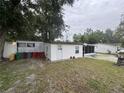 View of home from the backyard featuring a shed and white exterior at 721 Crestview Dr, Casselberry, FL 32707