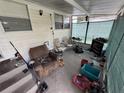 Enclosed porch area for additional space, with seating at 721 Crestview Dr, Casselberry, FL 32707