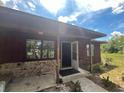 Welcoming entrance with an open door, showcasing the transition from outdoor charm to indoor comfort at 507 Cloudcroft Dr, Deltona, FL 32738
