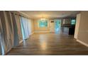 Spacious living room with new laminate flooring and natural light at 5641 Nw 55Th Ave, Ocala, FL 34482