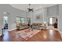 Spacious living room featuring hardwood floors and neutral paint at 17426 Tailfeather Ct, Clermont, FL 34711