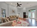 Cozy living room features hardwood floors, high ceilings, and natural light at 17426 Tailfeather Ct, Clermont, FL 34711