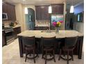 Gorgeous kitchen features a large center island, stainless appliances, and granite countertops at 1446 Vivaldi Pl, Longwood, FL 32779