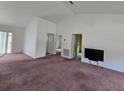 Bright living room area featuring neutral walls and an open floor plan at 860 S Grove St, Eustis, FL 32726