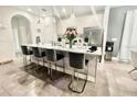 Modern kitchen with marble countertops and breakfast bar at 187 Brooke'S Pl, Haines City, FL 33844