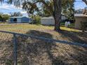 Large backyard with storage shed and chain link fence at 217 Bay E St, Davenport, FL 33837