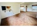 Open living room featuring a large window and an opening to the kitchen at 2496 Brooke Rd, Fort Meade, FL 33841