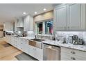 Bright kitchen with white cabinets, stainless steel appliances, and a farmhouse sink at 4523 Hallamview Ln, Lakeland, FL 33813