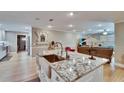 Kitchen island features granite counters, stainless steel sink, and views into the living room at 4523 Hallamview Ln, Lakeland, FL 33813